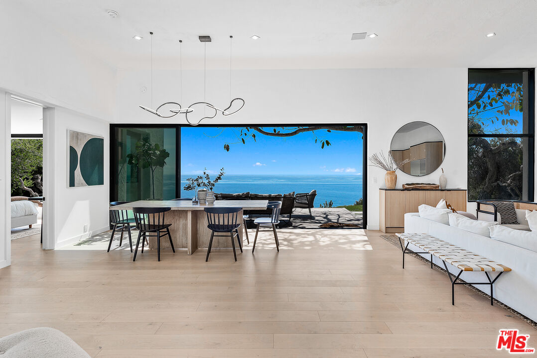 29122 Cliffside Drive Malibu, CA 90265 - Photo 9 of 39 a living room with furniture and a large window