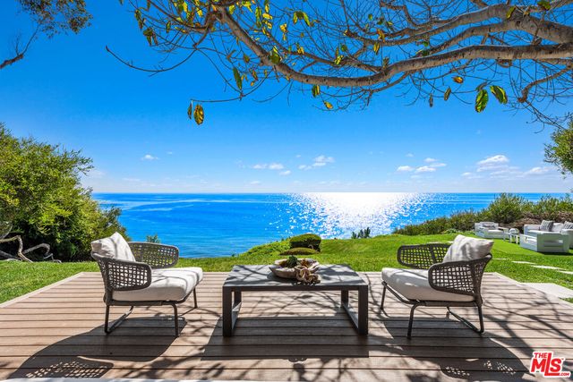 a view of a patio with chair and table
