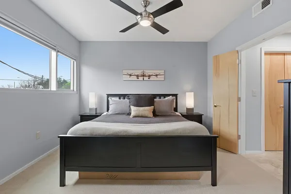 a bedroom with a bed and window