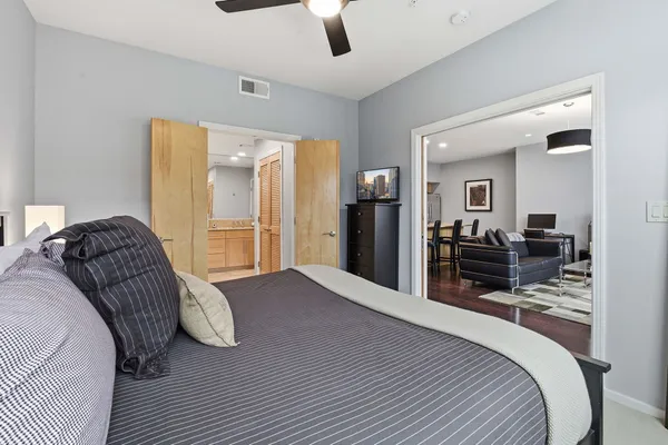 a bed room with a bed and a television