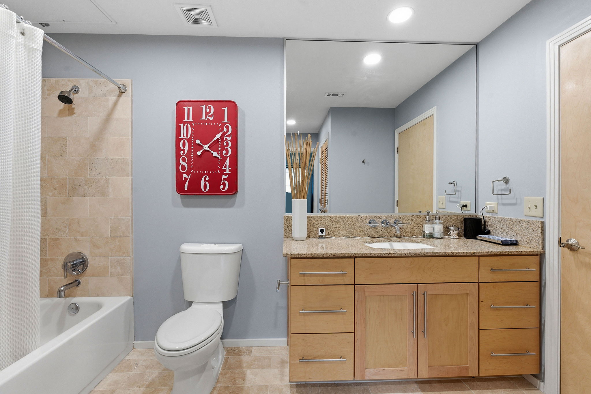 1600 Barton Springs Road, Unit 1106 Austin, TX 78704 - Photo 21 of 39 a bathroom with a toilet sink and mirror