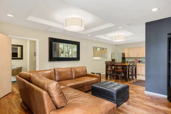 a living room with furniture a couch and a bookshelf