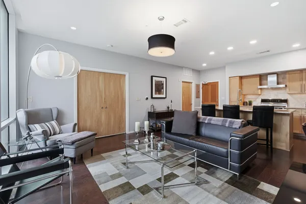 a living room with furniture and a large window