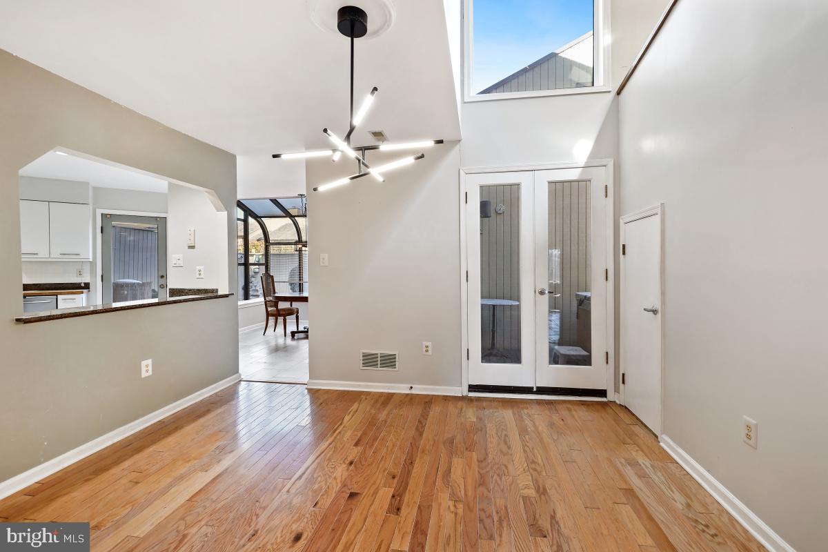 3004 Courtside Road Bowie, MD 20721 - Photo 11 of 45 a view of a room with wooden floor and a ceiling fan