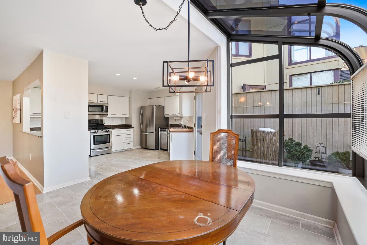 3004 Courtside Road Bowie, MD 20721 - Photo 15 of 45 a view of a kitchen with furniture and wooden floor
