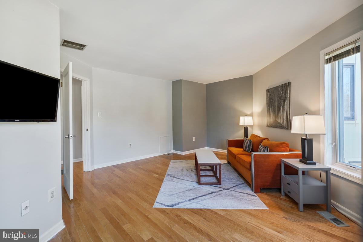 3004 Courtside Road Bowie, MD 20721 - Photo 32 of 45 a living room with furniture and a flat screen tv