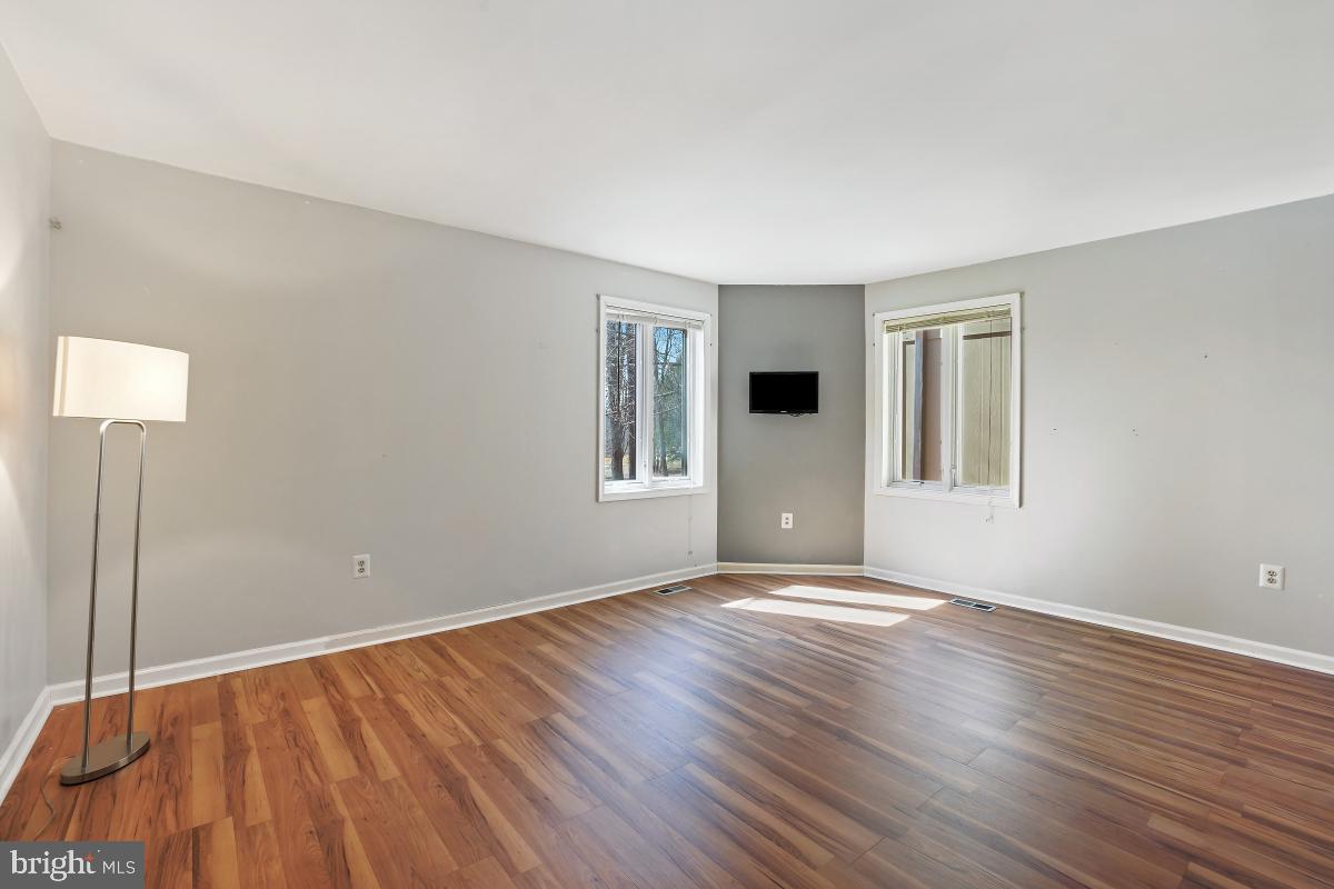 3004 Courtside Road Bowie, MD 20721 - Photo 35 of 45 a view of an empty room with window and wooden floor