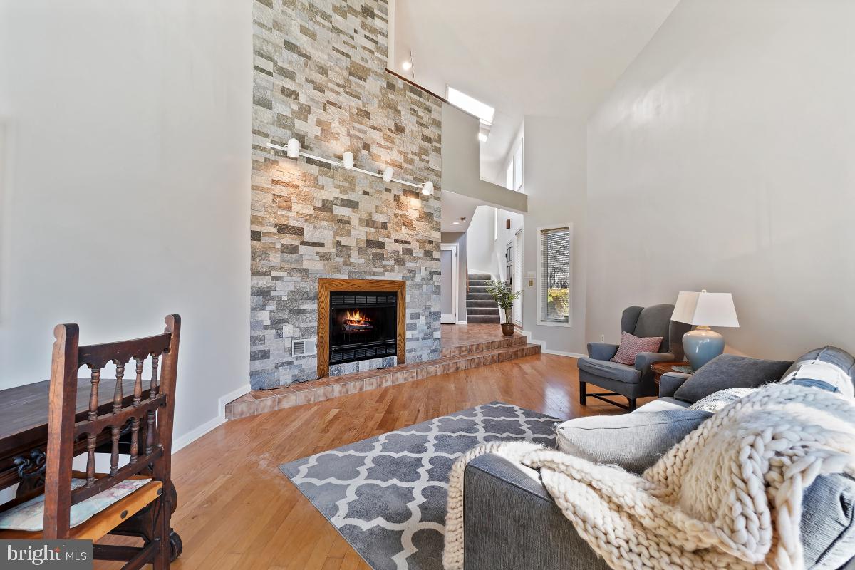 3004 Courtside Road Bowie, MD 20721 - Photo 9 of 45 a living room with furniture and a fireplace