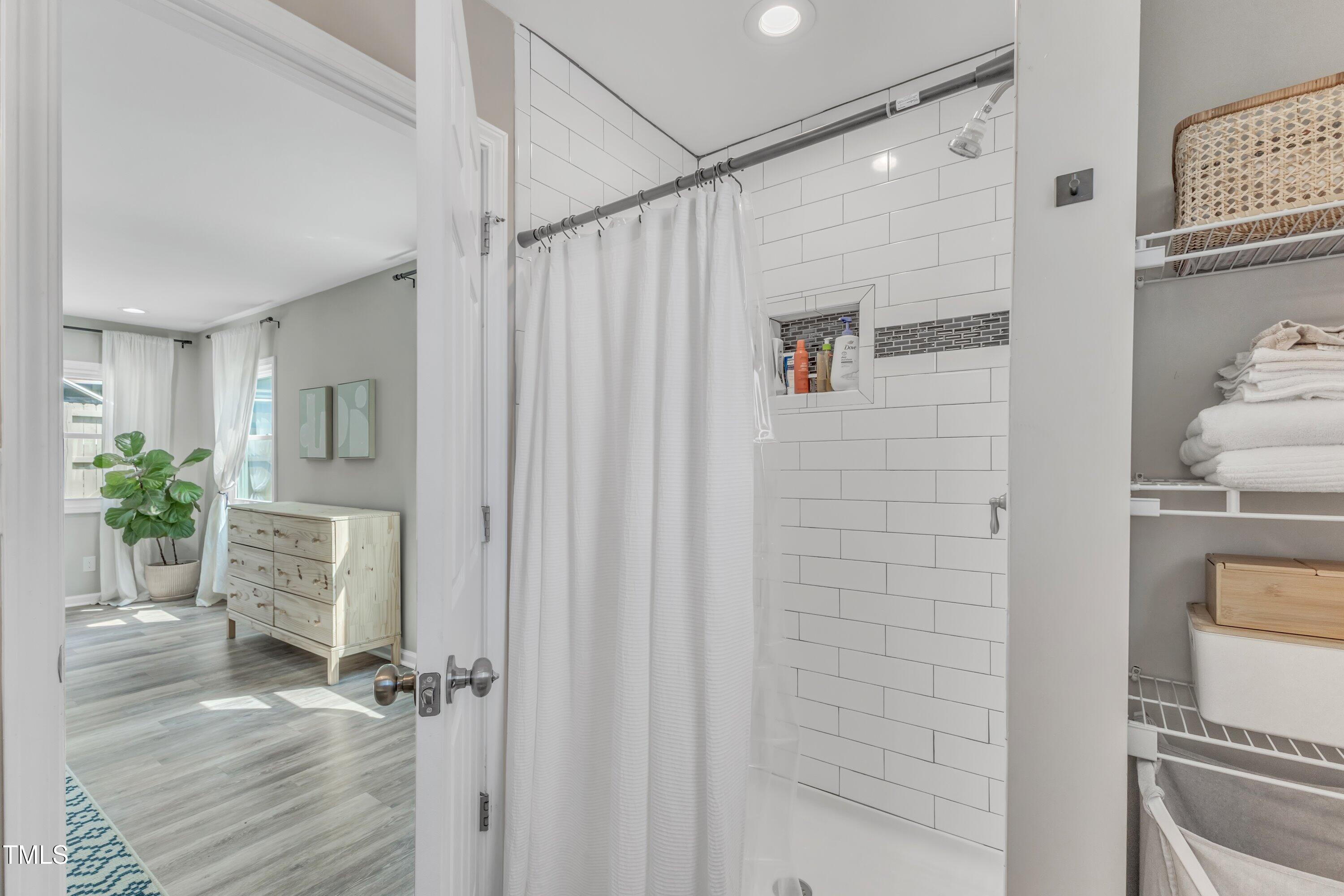 701 Coleman Street Raleigh, NC 27610 - Photo 23 of 38 a bathroom with a shower and a toilet