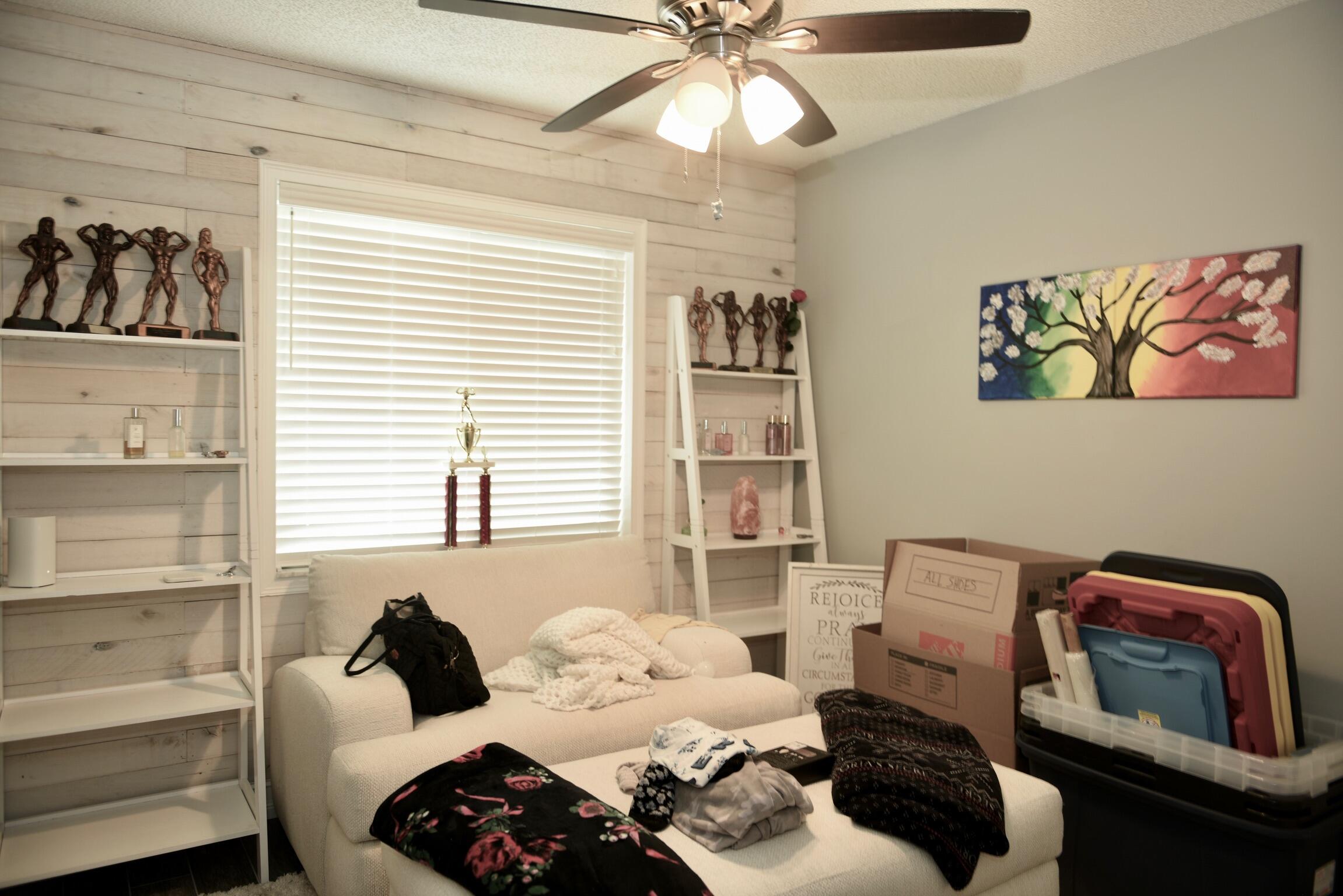 14931 Southwest 168th Court Miami, FL 33187 - Photo 15 of 34 a bedroom with a bed and a window