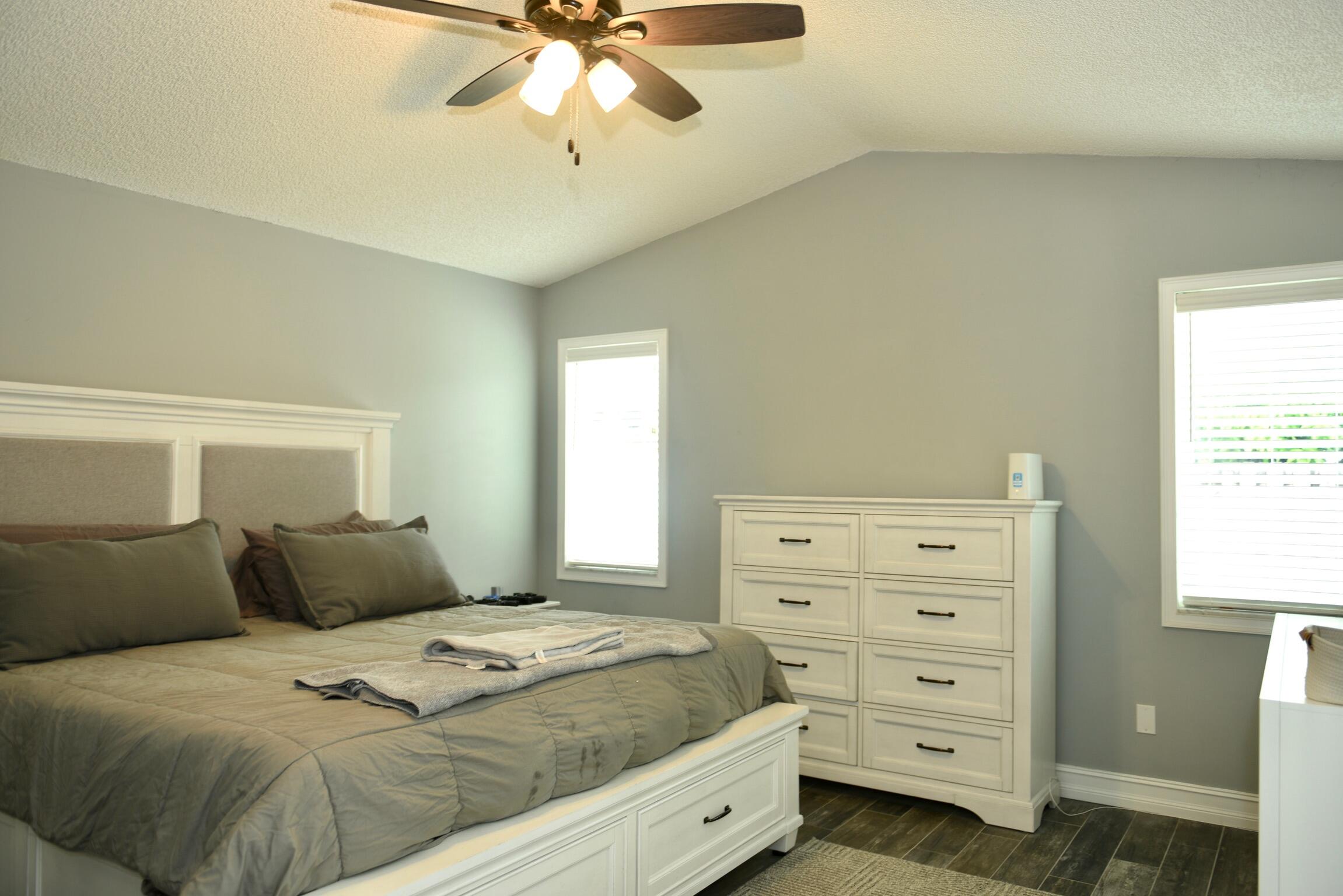 14931 Southwest 168th Court Miami, FL 33187 - Photo 17 of 34 a bedroom with a bed and window