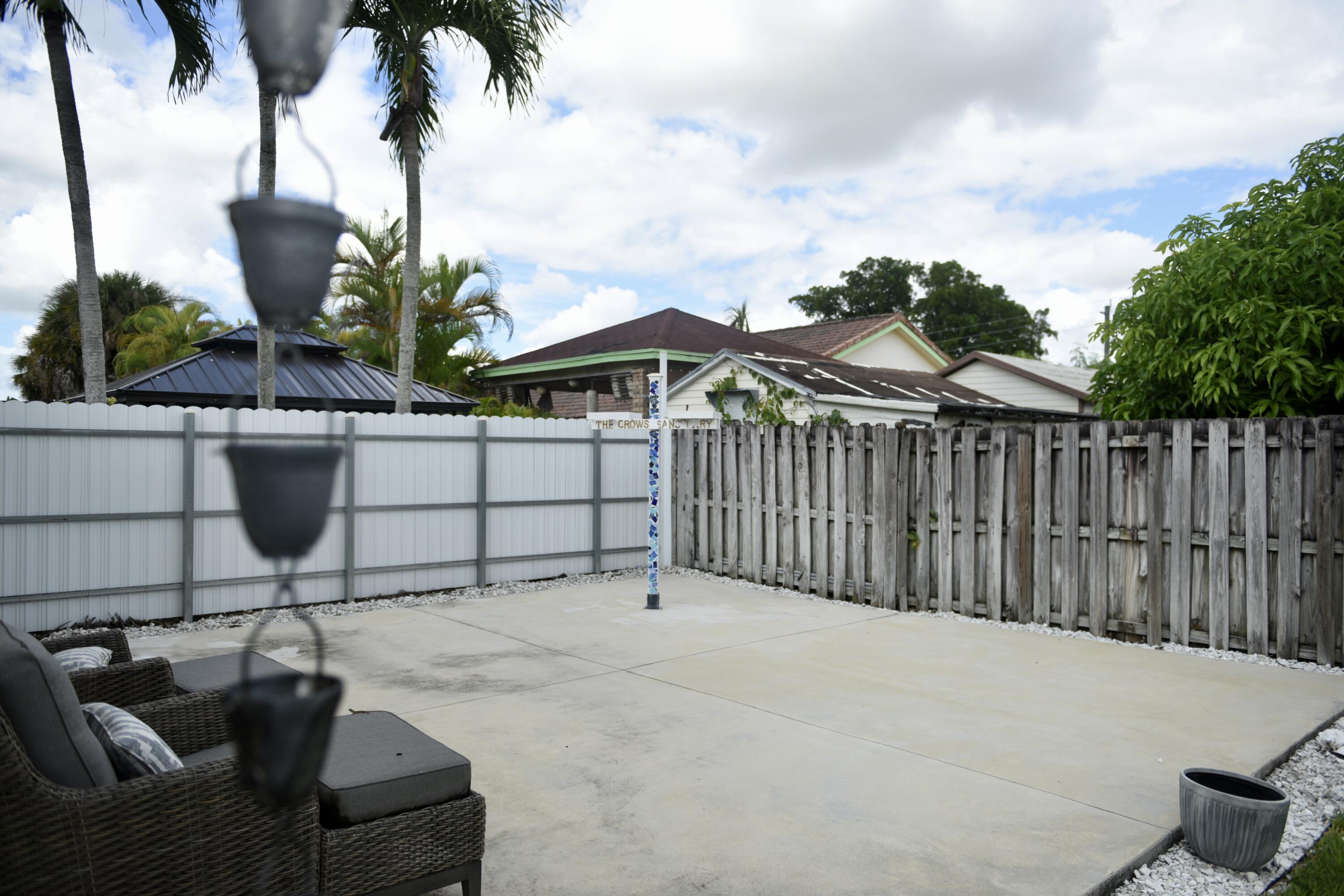 14931 Southwest 168th Court Miami, FL 33187 - Photo 21 of 34 a view of backyard with outdoor seating and plants