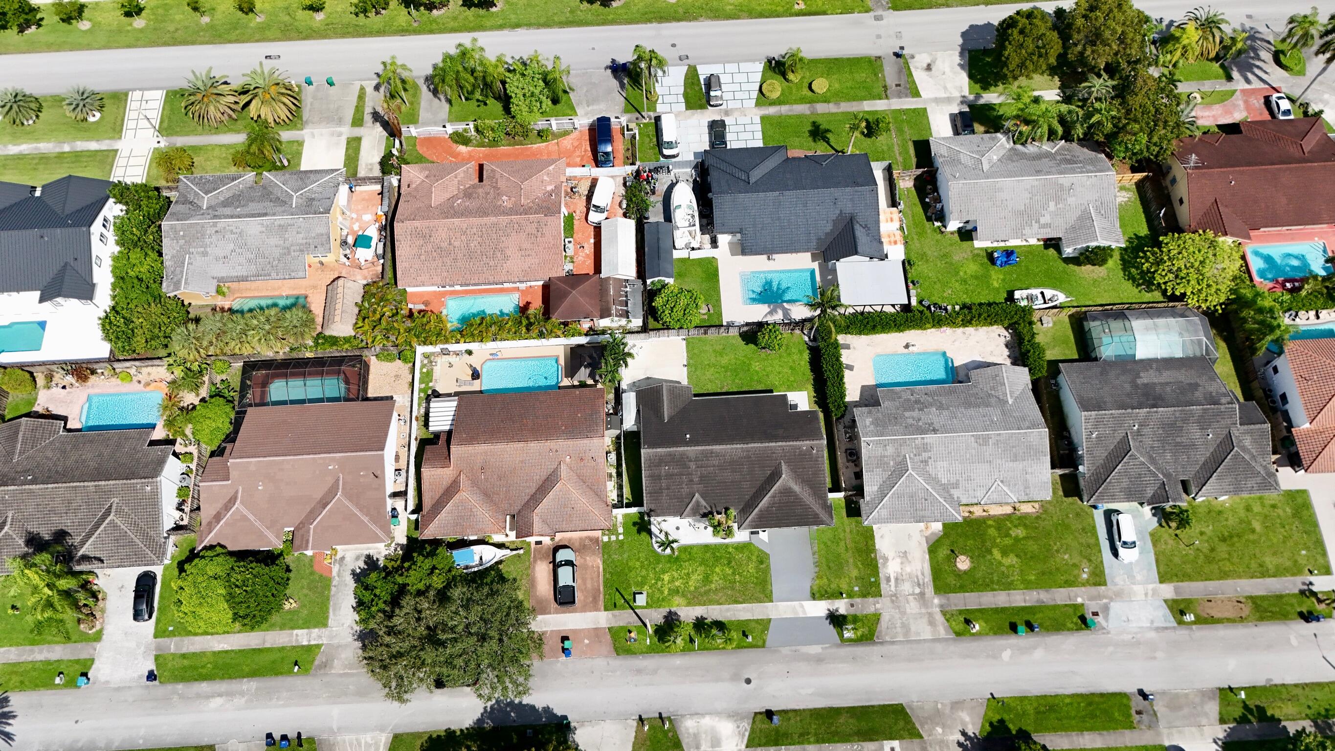 14931 Southwest 168th Court Miami, FL 33187 - Photo 26 of 34 an aerial view of multiple houses with yard