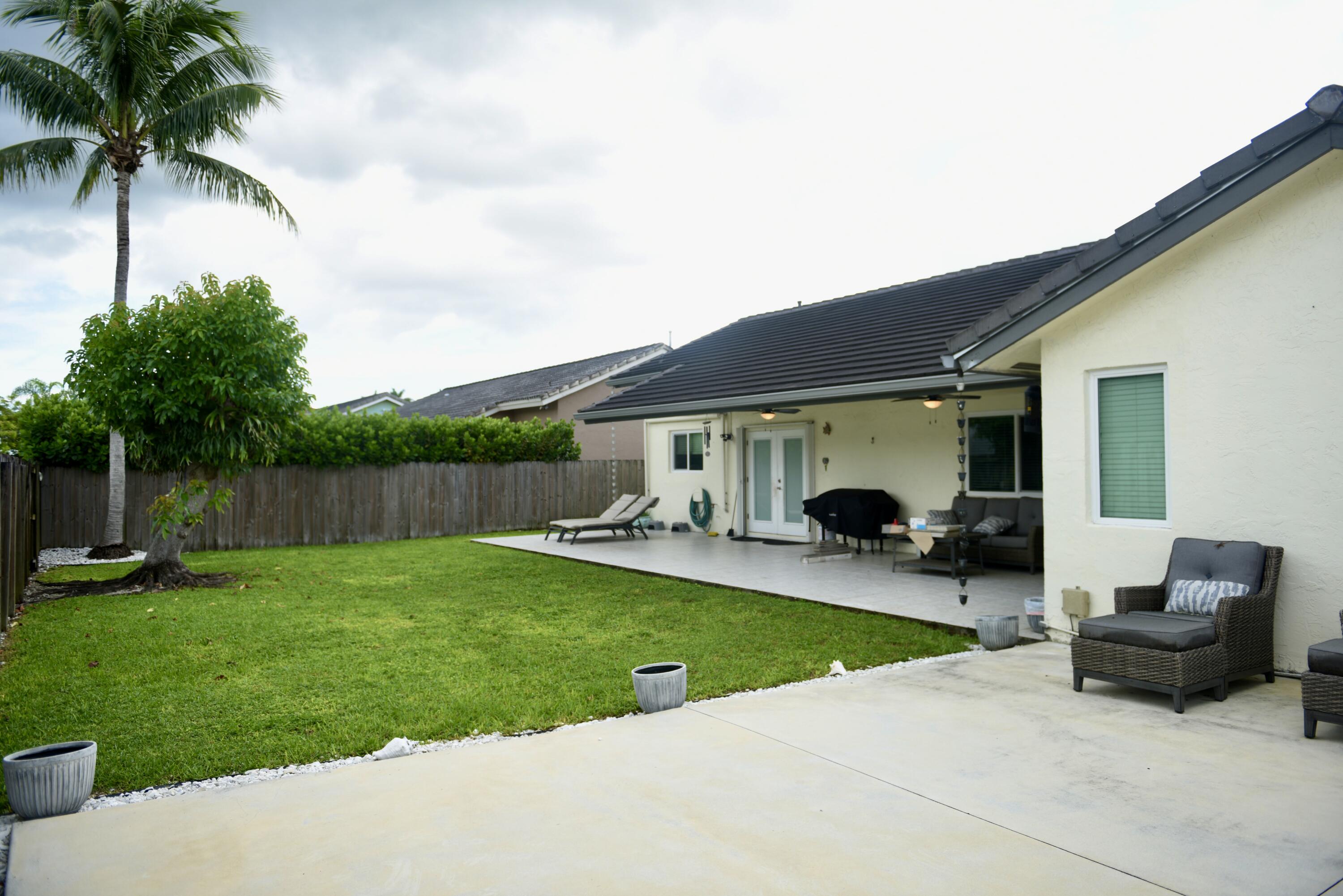 14931 Southwest 168th Court Miami, FL 33187 - Photo 33 of 34 a view of swimming pool with garden