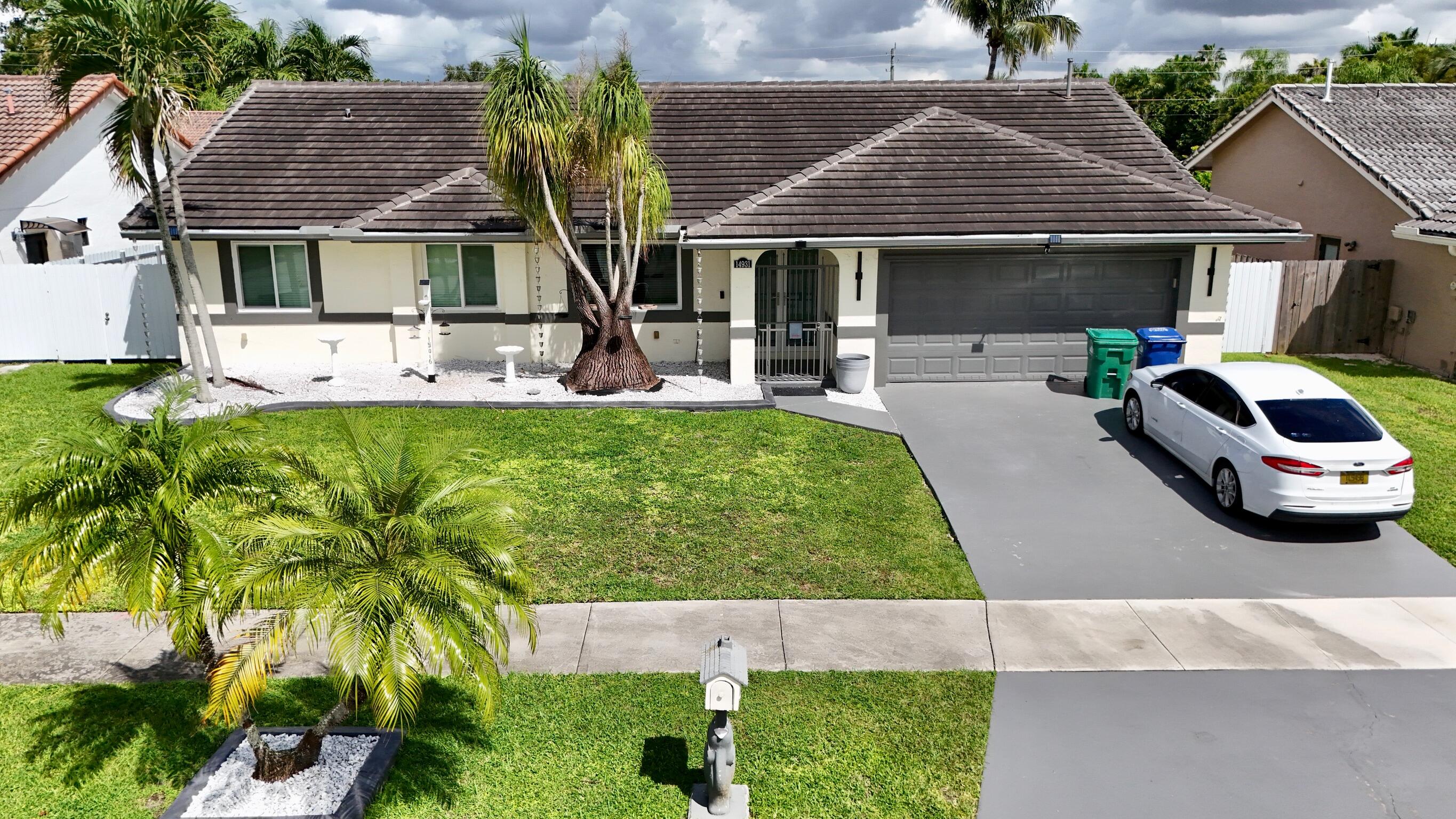 14931 Southwest 168th Court Miami, FL 33187 - Photo 34 of 34 a front view of a house with garden