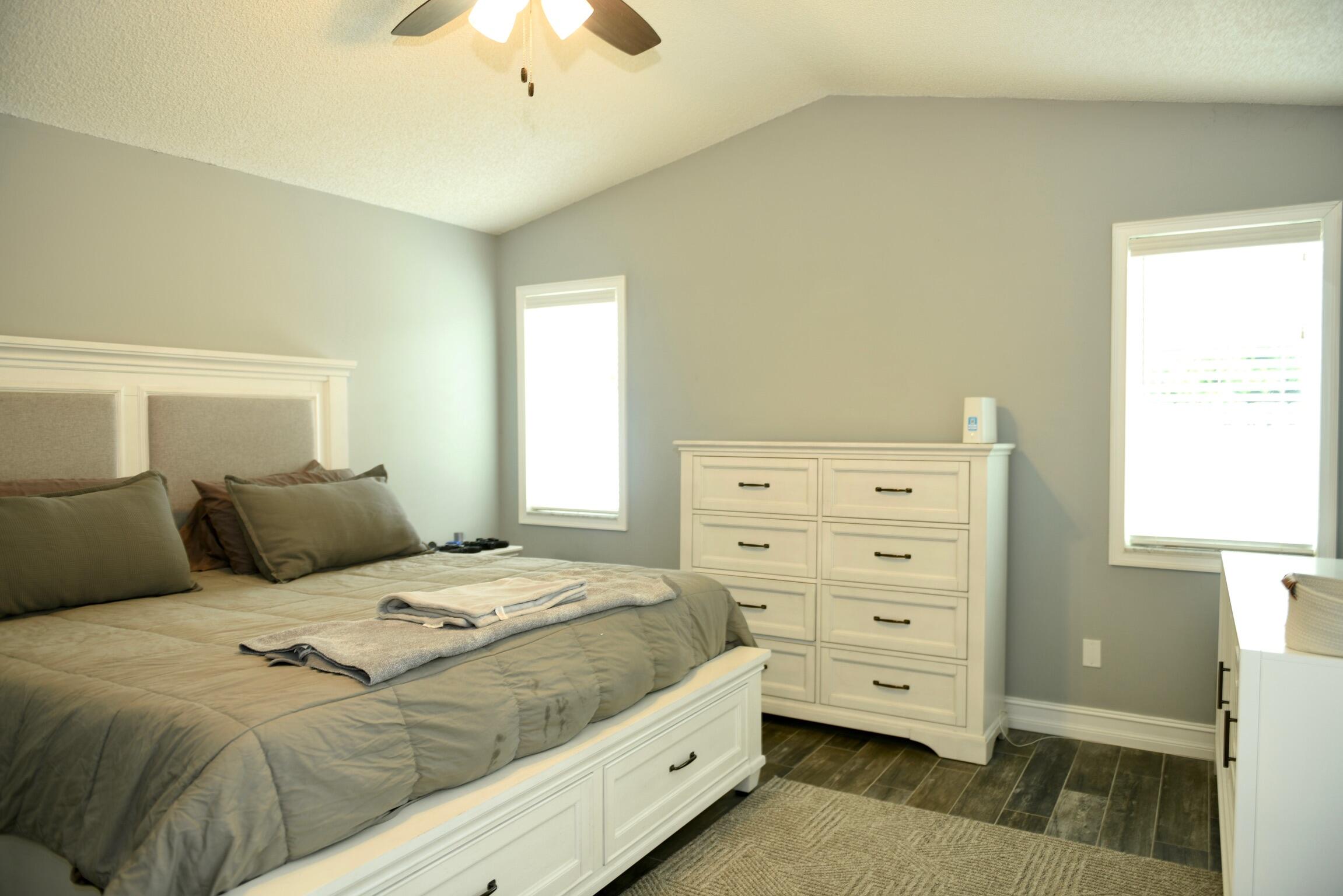 14931 Southwest 168th Court Miami, FL 33187 - Photo 4 of 34 a bedroom with a bed and a dresser