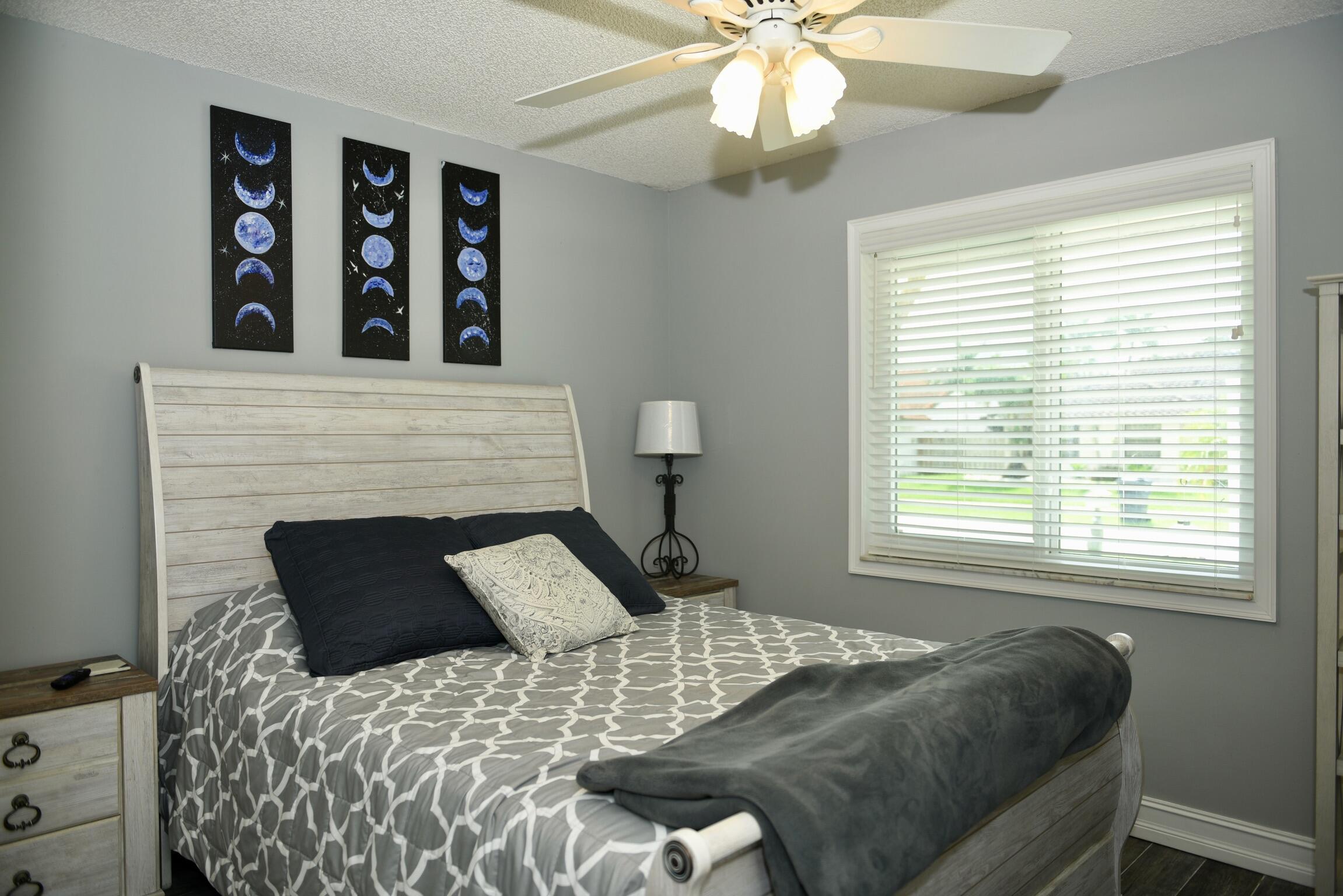 14931 Southwest 168th Court Miami, FL 33187 - Photo 6 of 34 a bedroom with a bed and a window