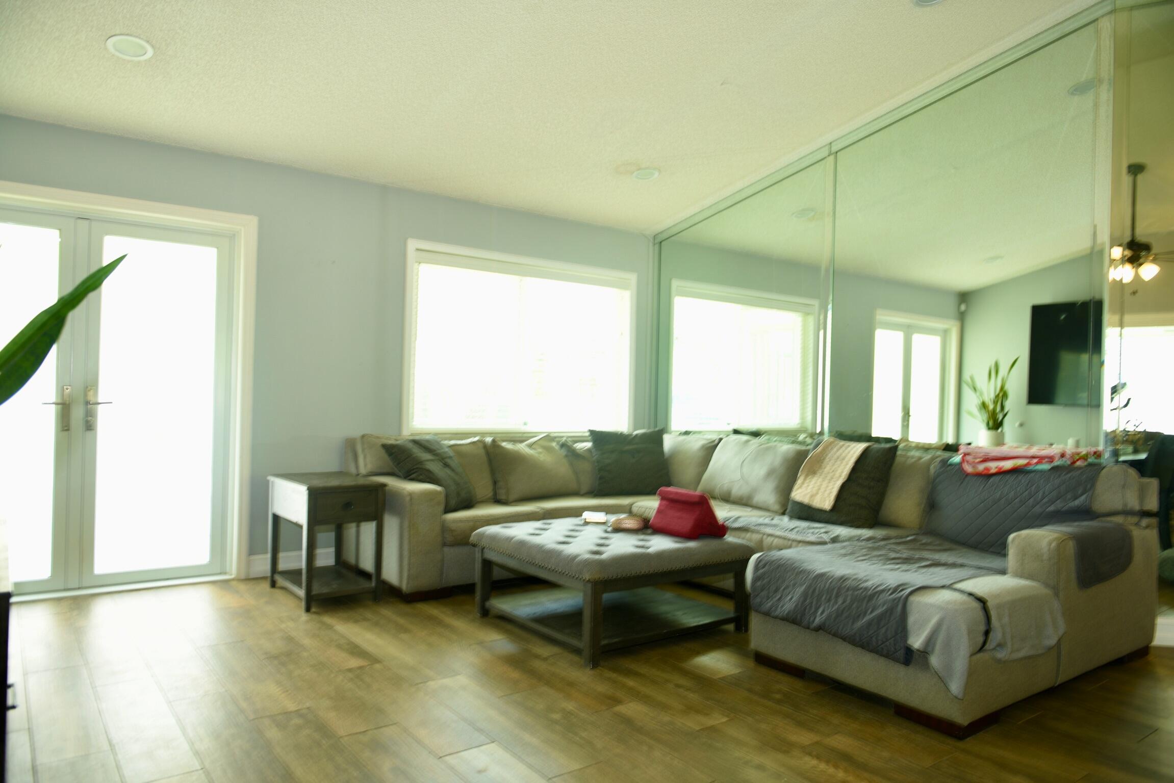 14931 Southwest 168th Court Miami, FL 33187 - Photo 7 of 34 a living room with furniture and a large window