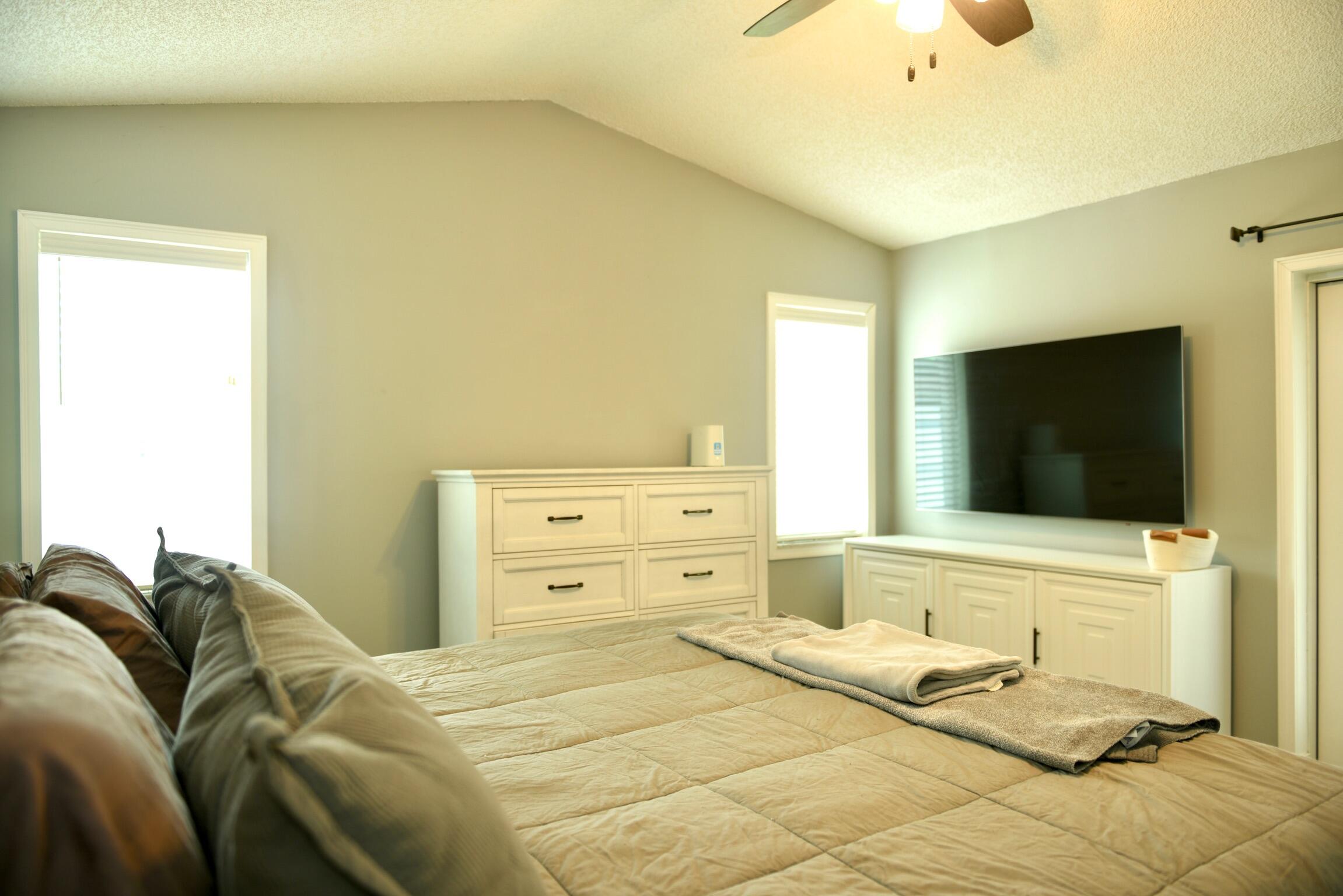 14931 Southwest 168th Court Miami, FL 33187 - Photo 9 of 34 a bedroom with a bed and a flat tv screen