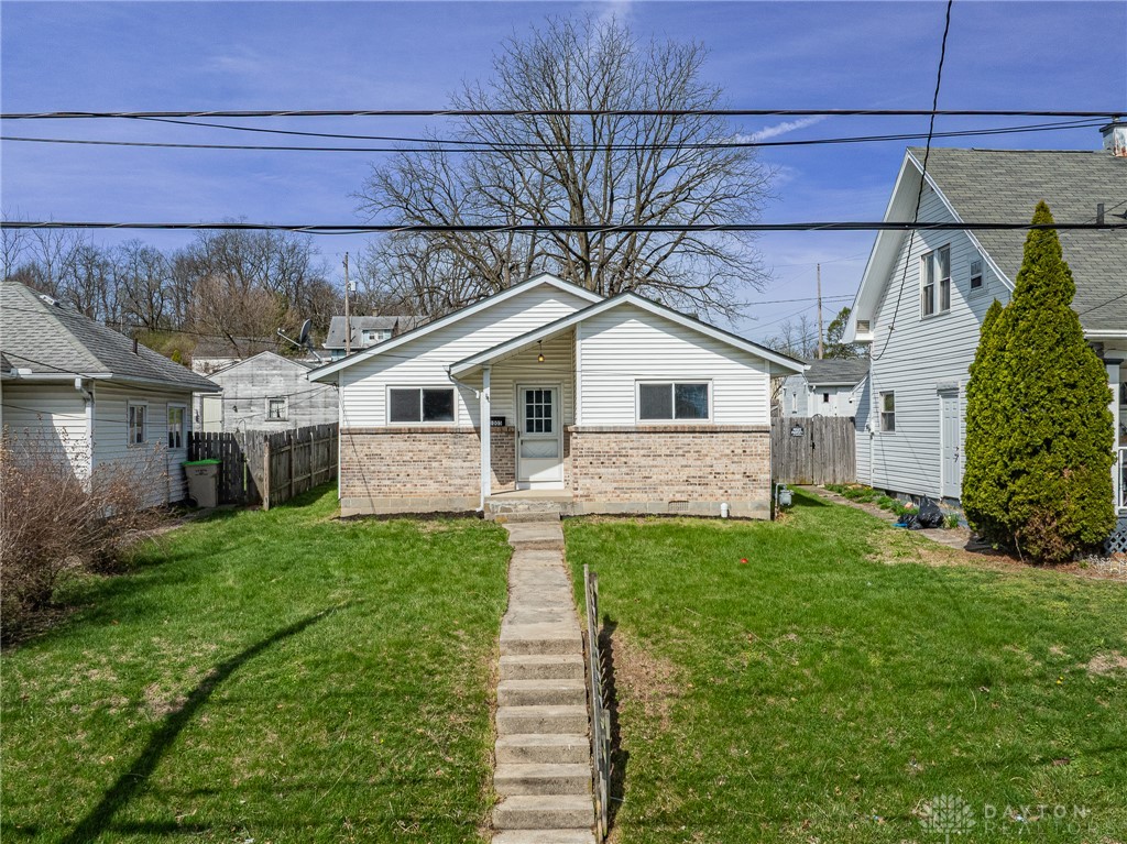 1005 Burt Street Springfield, OH 45505 - Photo 2 of 33 This charming residence features a well-maintained exterior with a inviting front yard.
