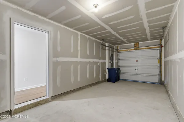 a front view of a residential apartment building with a yard