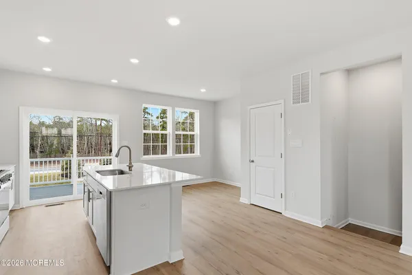a kitchen with stainless steel appliances a sink stove and refrigerator