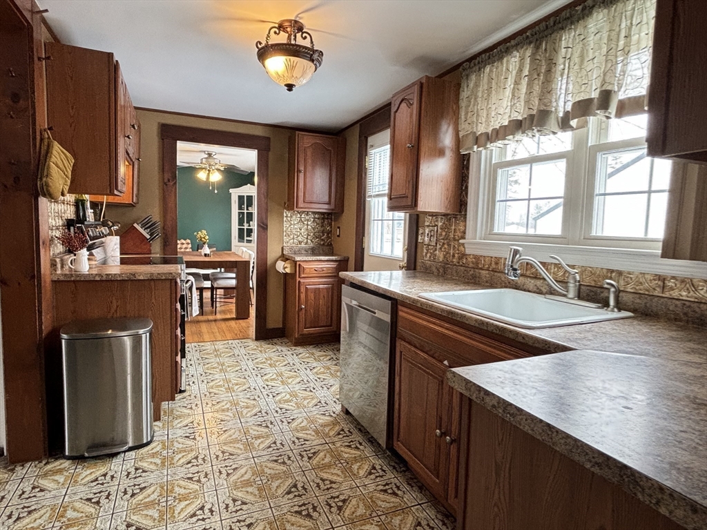 82 Prospect Street Gardner, MA 01440 - Photo 16 of 41 a large kitchen with stainless steel appliances granite countertop a sink stove and refrigerator