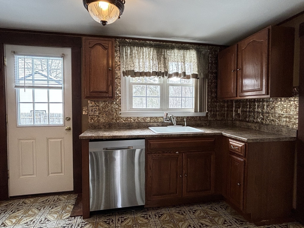 82 Prospect Street Gardner, MA 01440 - Photo 18 of 41 a kitchen with a sink cabinets and window