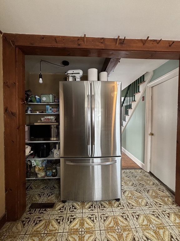 82 Prospect Street Gardner, MA 01440 - Photo 19 of 41 a view of a refrigerator in kitchen and wooden floor