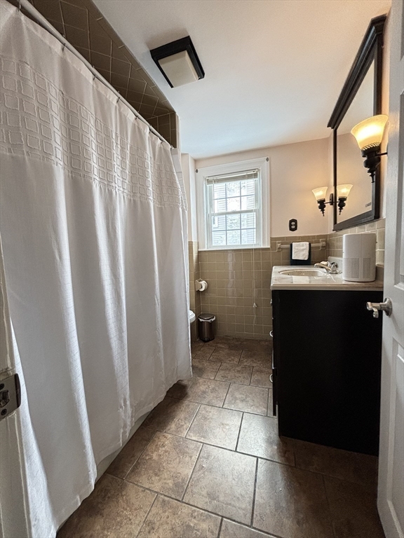 82 Prospect Street Gardner, MA 01440 - Photo 20 of 41 a kitchen with a sink a refrigerator and window