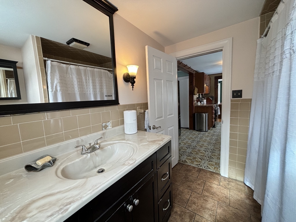 82 Prospect Street Gardner, MA 01440 - Photo 21 of 41 a bathroom with a sink and a mirror