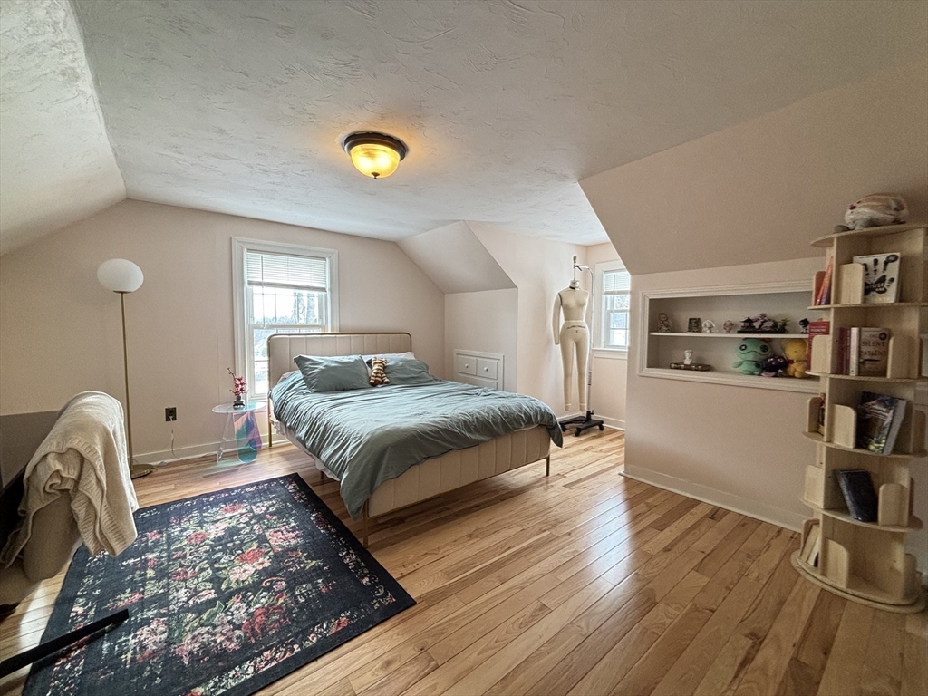 82 Prospect Street Gardner, MA 01440 - Photo 27 of 41 a bedroom with a bed and a book shelf