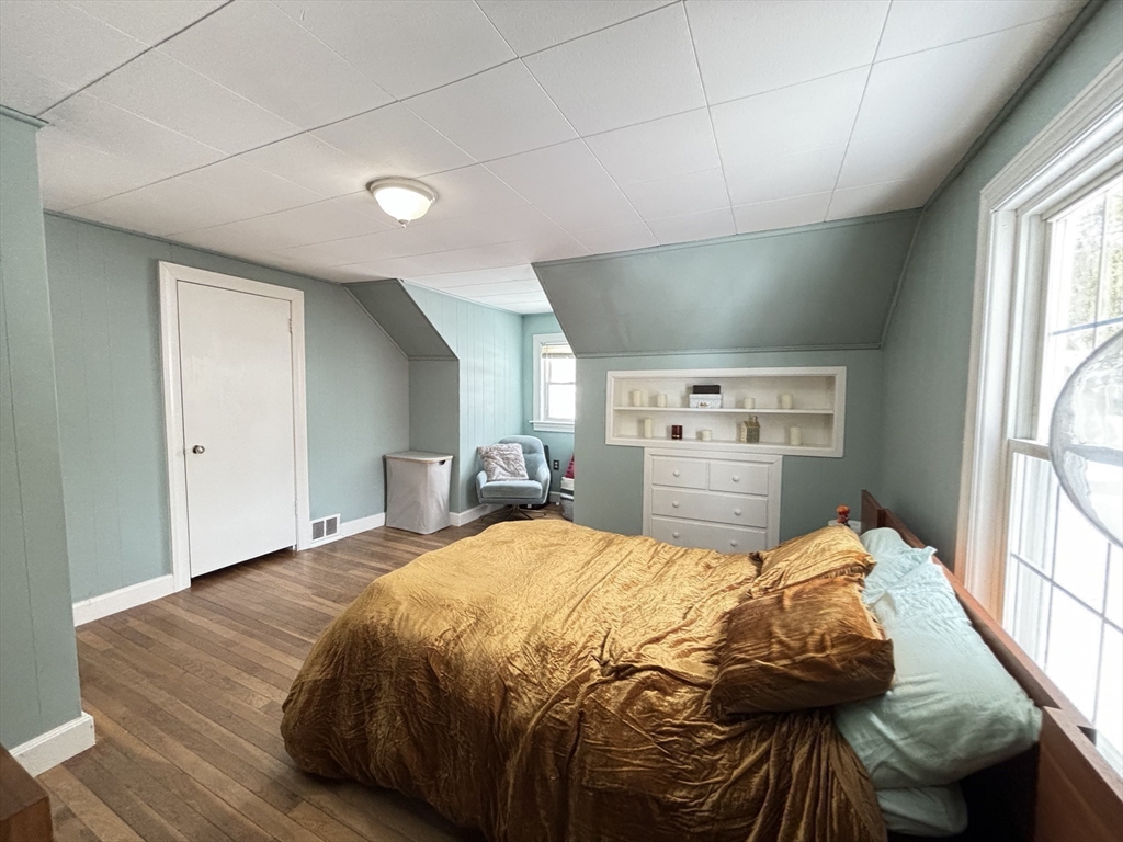 82 Prospect Street Gardner, MA 01440 - Photo 32 of 41 a bed sitting in a bedroom next to a window