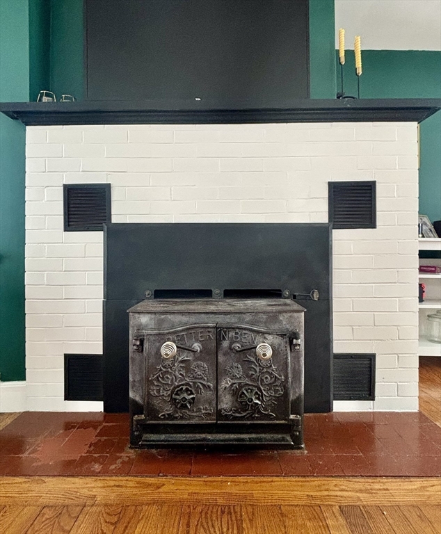 82 Prospect Street Gardner, MA 01440 - Photo 8 of 41 a fireplace with glass door