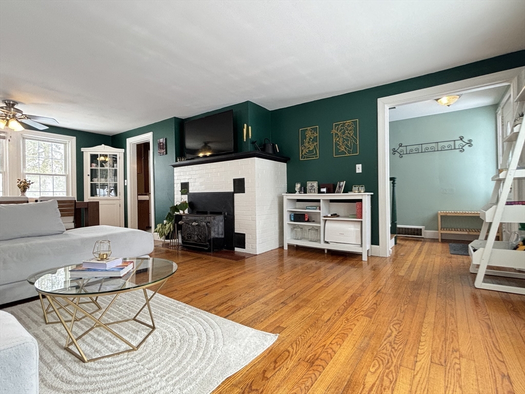 82 Prospect Street Gardner, MA 01440 - Photo 10 of 41 a living room with furniture and a fireplace