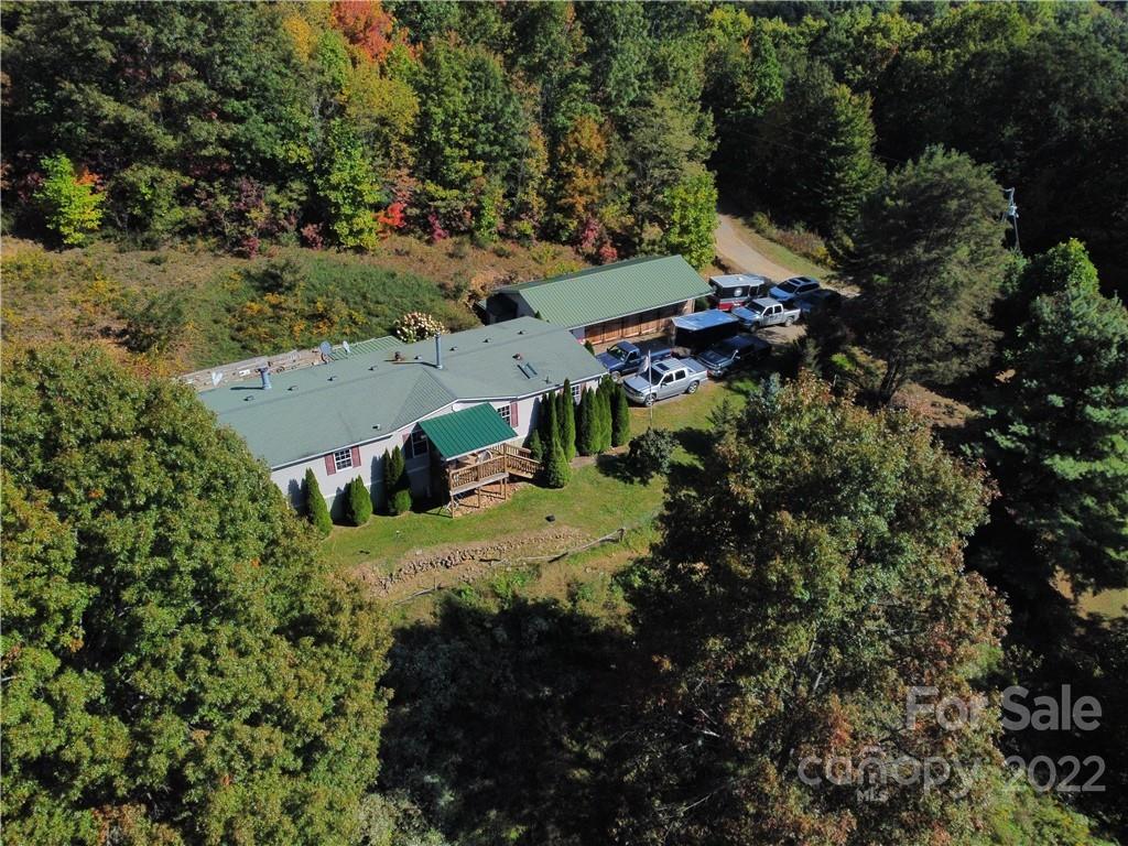 251 Rustic Ridge Drive Canton, NC 28716 - Photo 2 of 32 an aerial view of a house with a yard