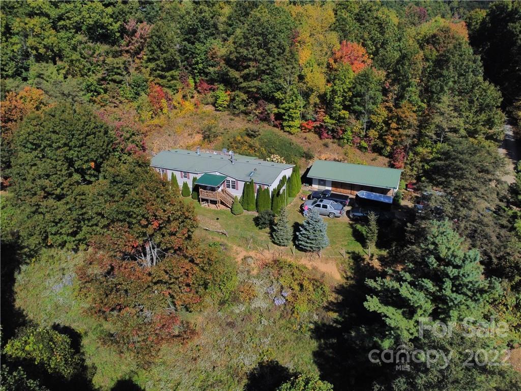 251 Rustic Ridge Drive Canton, NC 28716 - Photo 3 of 32 an aerial view of a house with a yard