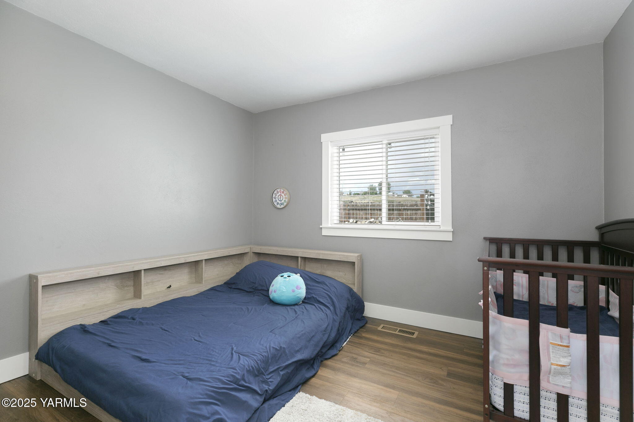 910 Gromore Road Yakima, WA 98908 - Photo 13 of 32 a view of bedroom with furniture and window