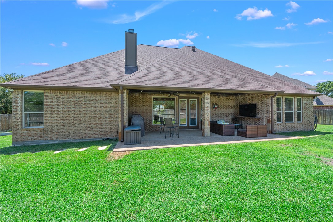 3301 Covington Court Bryan, TX 77808 - Photo 22 of 26 a view of a house with a yard and porch