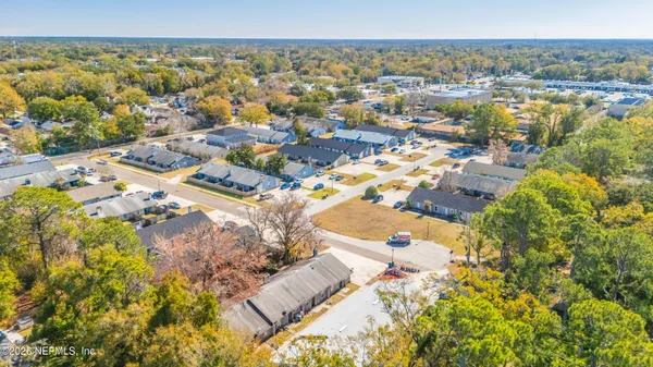 a backyard of a house with yard and outdoor seating
