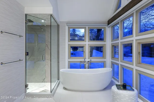a living room with window and a glass door