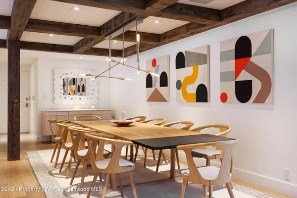 a very nice looking dining room with a table and chairs
