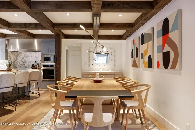 a view of a dining room with furniture and window