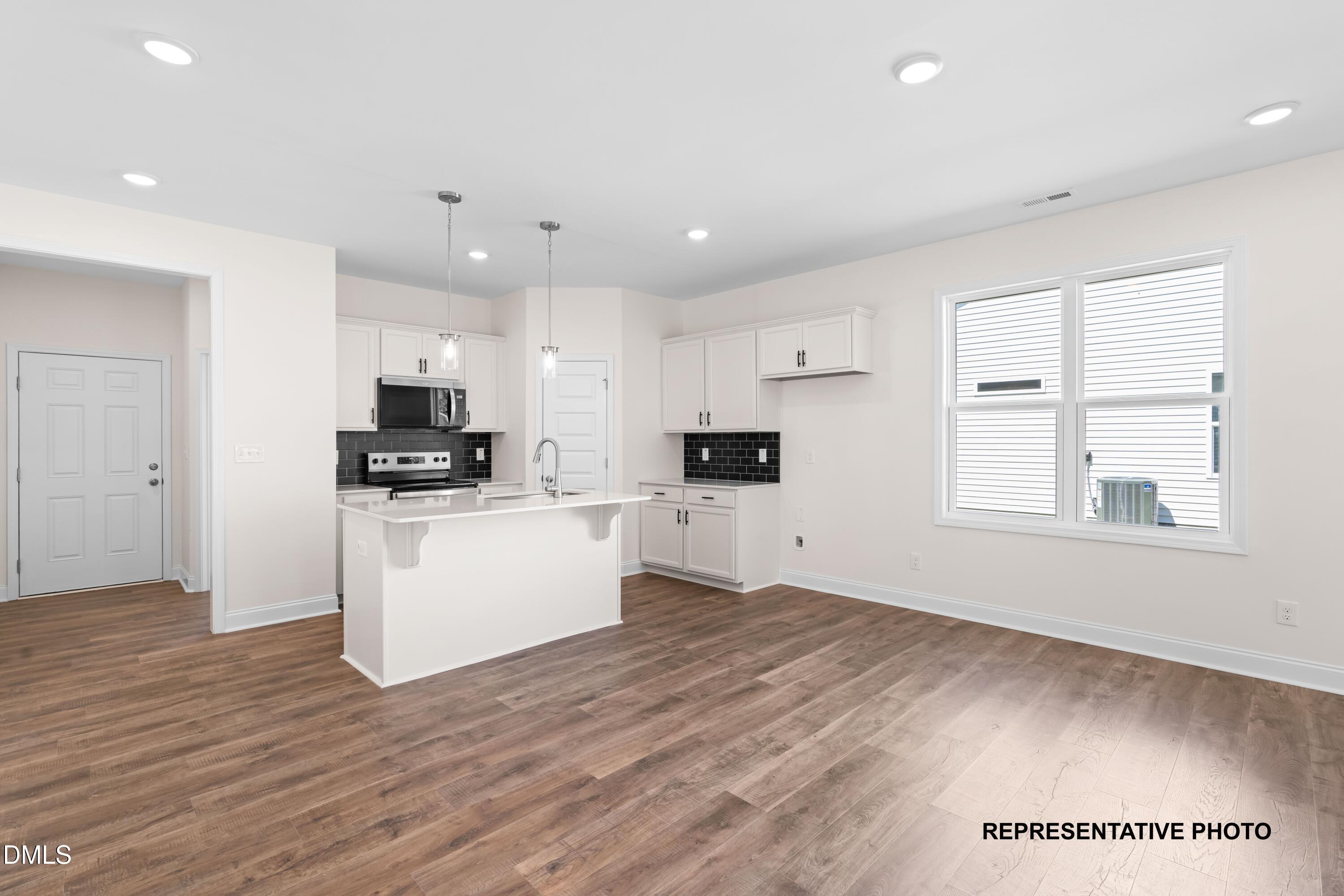 54 Cupid Court Middlesex, NC 27557 - Photo 3 of 7 a view of kitchen with wooden floor and electronic appliances