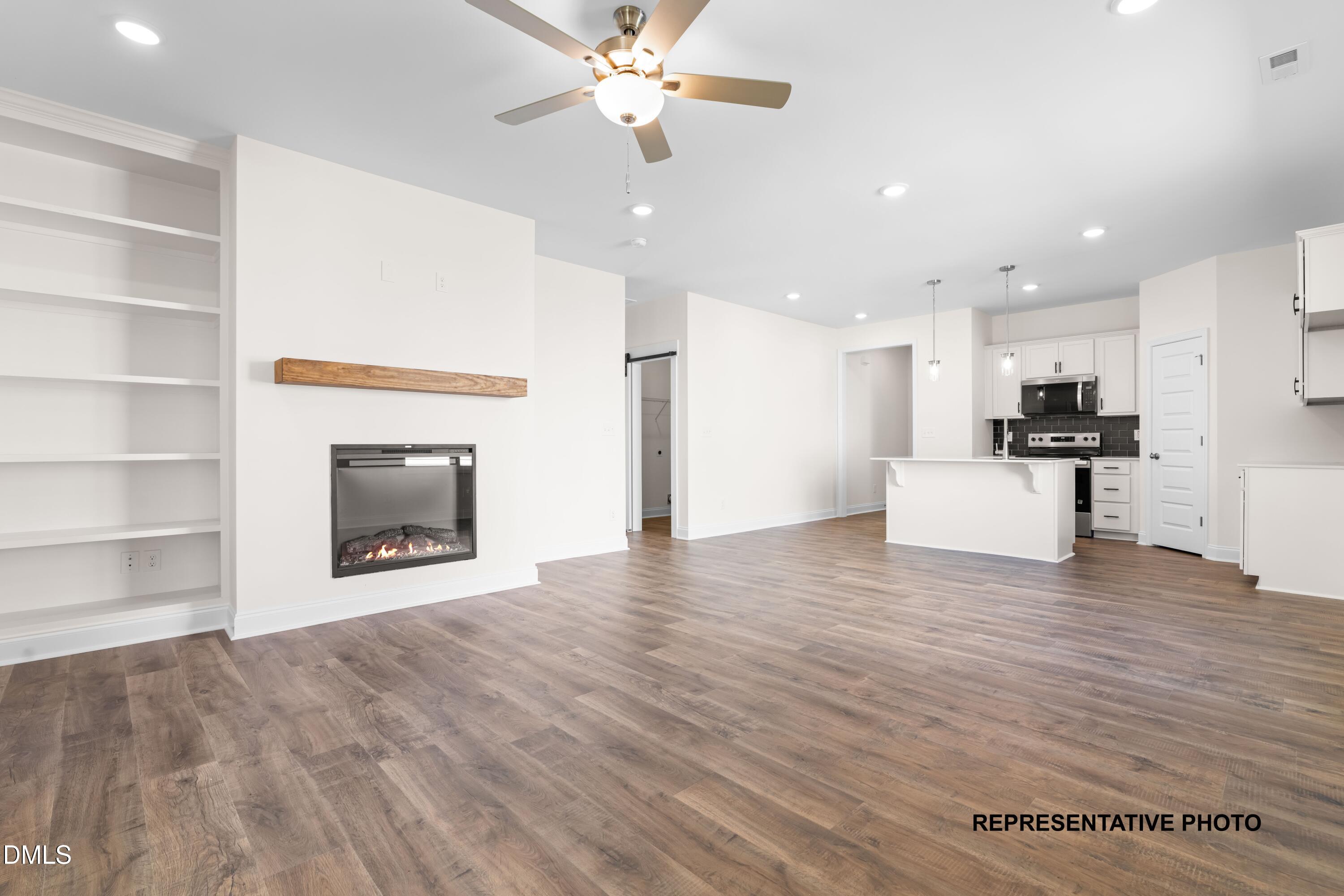 54 Cupid Court Middlesex, NC 27557 - Photo 4 of 7 a view of a kitchen with furniture and a fireplace