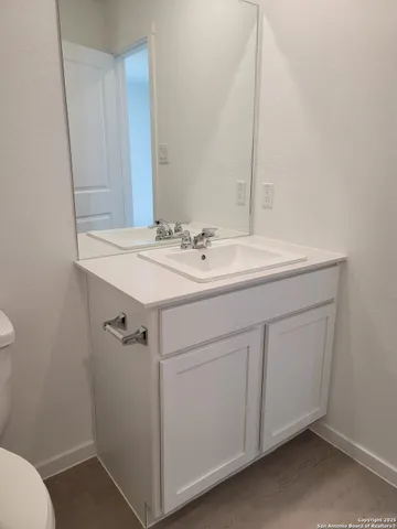a bathroom with a sink and a toilet
