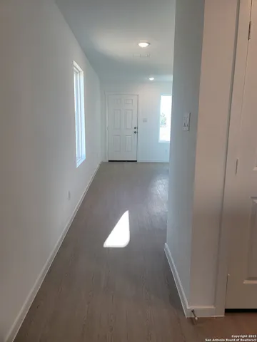 an empty room with windows and yard