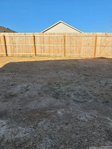 a view of a house with backyard
