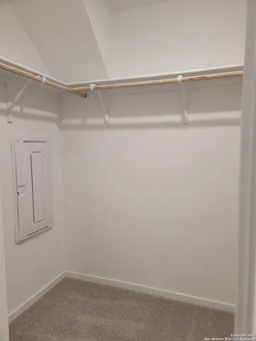 a view of an empty walk in closet