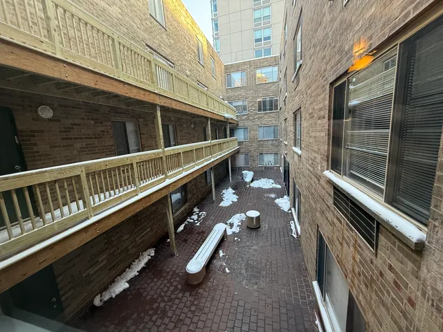 a balcony with view of an outdoor space